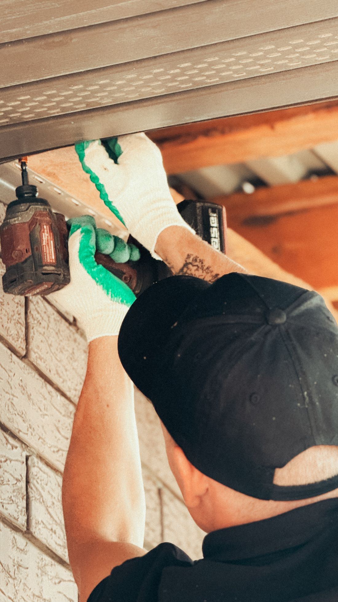 Working at the eaves of a home exterior
